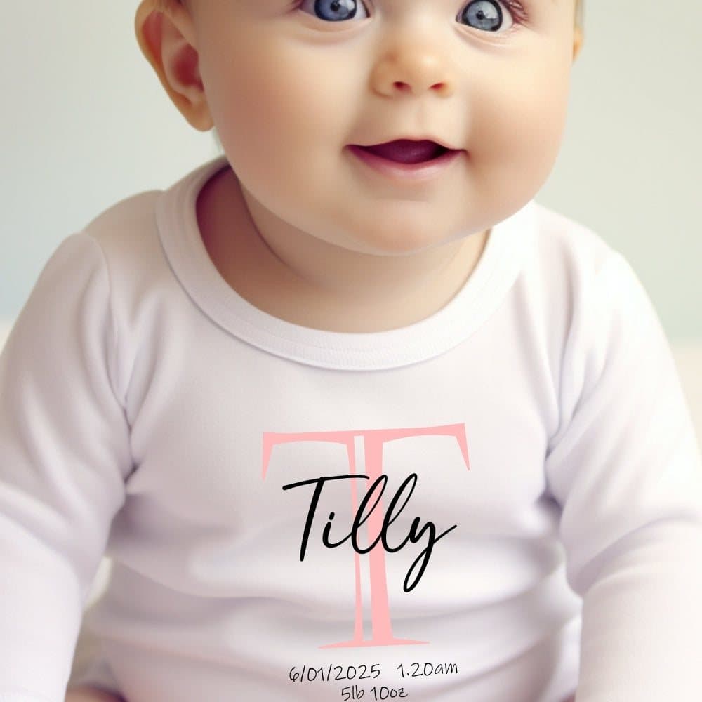 Pink initial personalised baby grow, vest or bib with a name