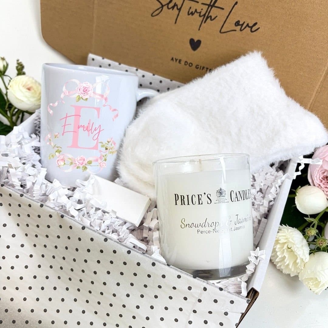 Personalised pink roses mug, fluffy socks, scented candle and matches in a gift hamper