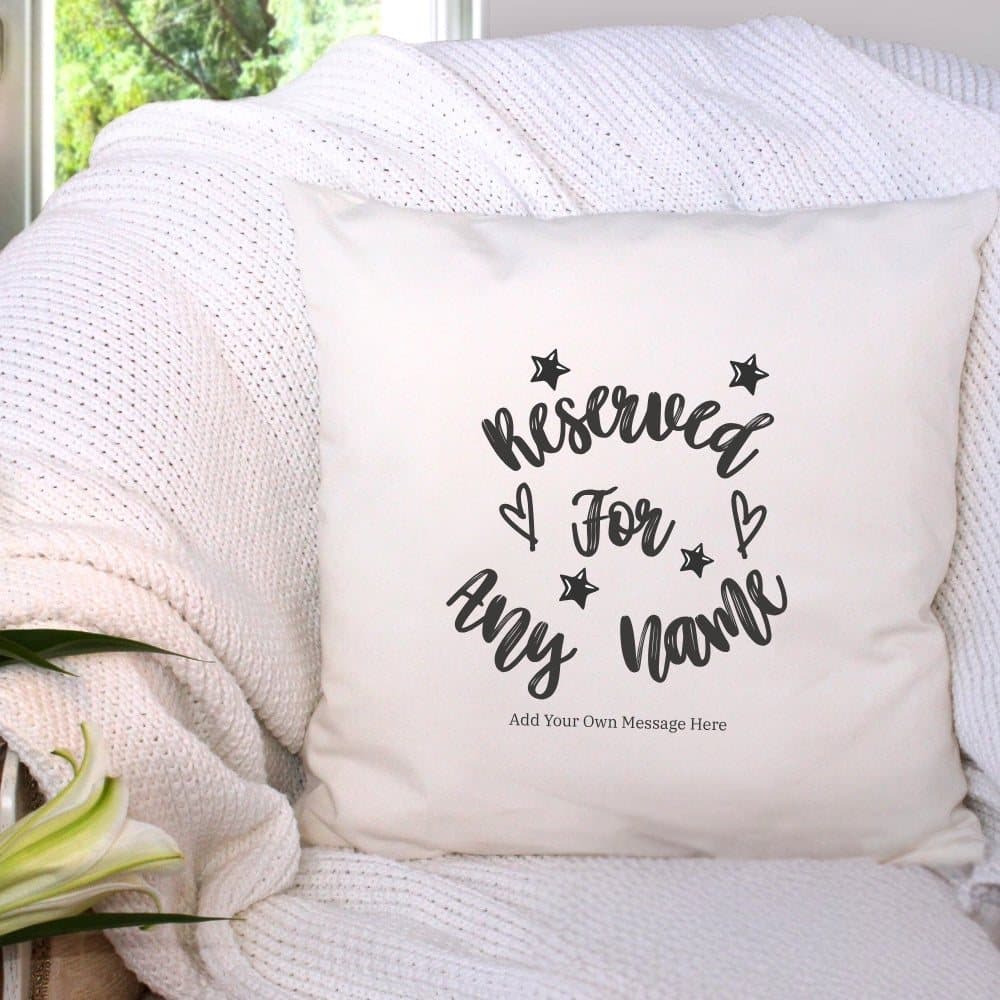 Cream personalised cushion with a Reserved for message, stars and hearts design.