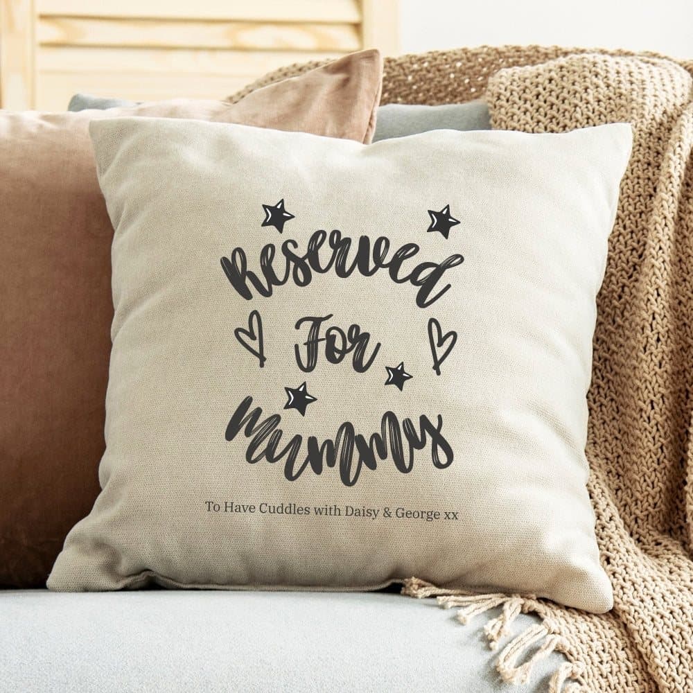 Cream linen-look cushion with a Reserved for Mummy design, stars and hearts.