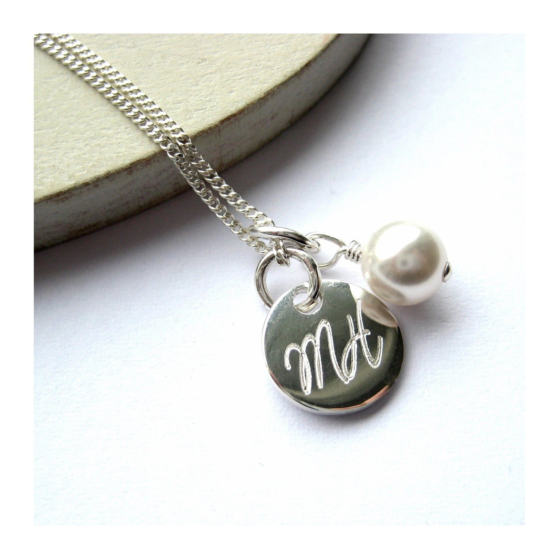 Personalised script disc necklace with a glass pearl on a sterling silver chain