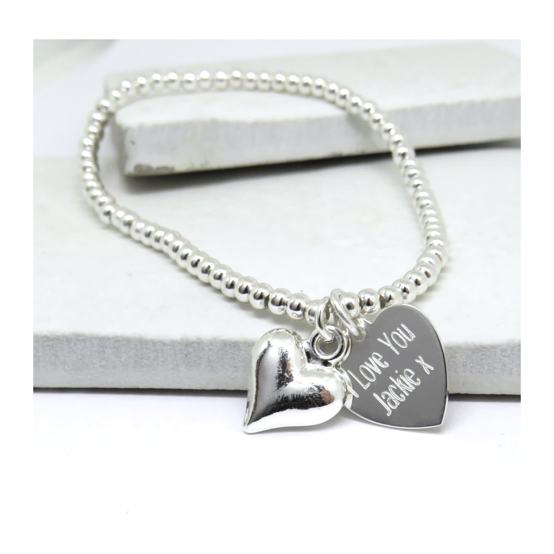 Personalised silver heart stretch beaded bracelet with a silver heart charm