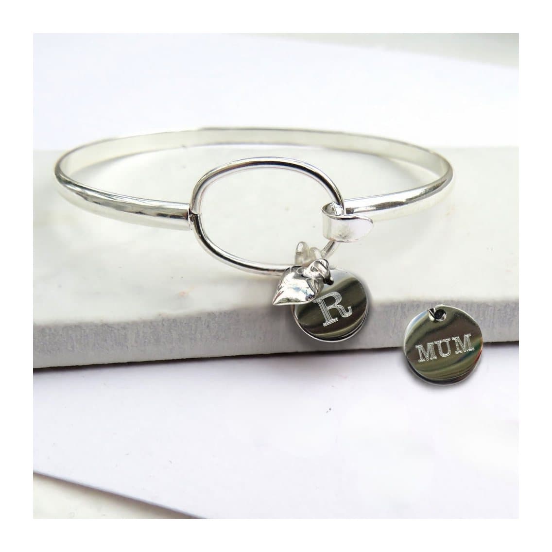 Silver plated personalised bangle with a heart charm and round disc