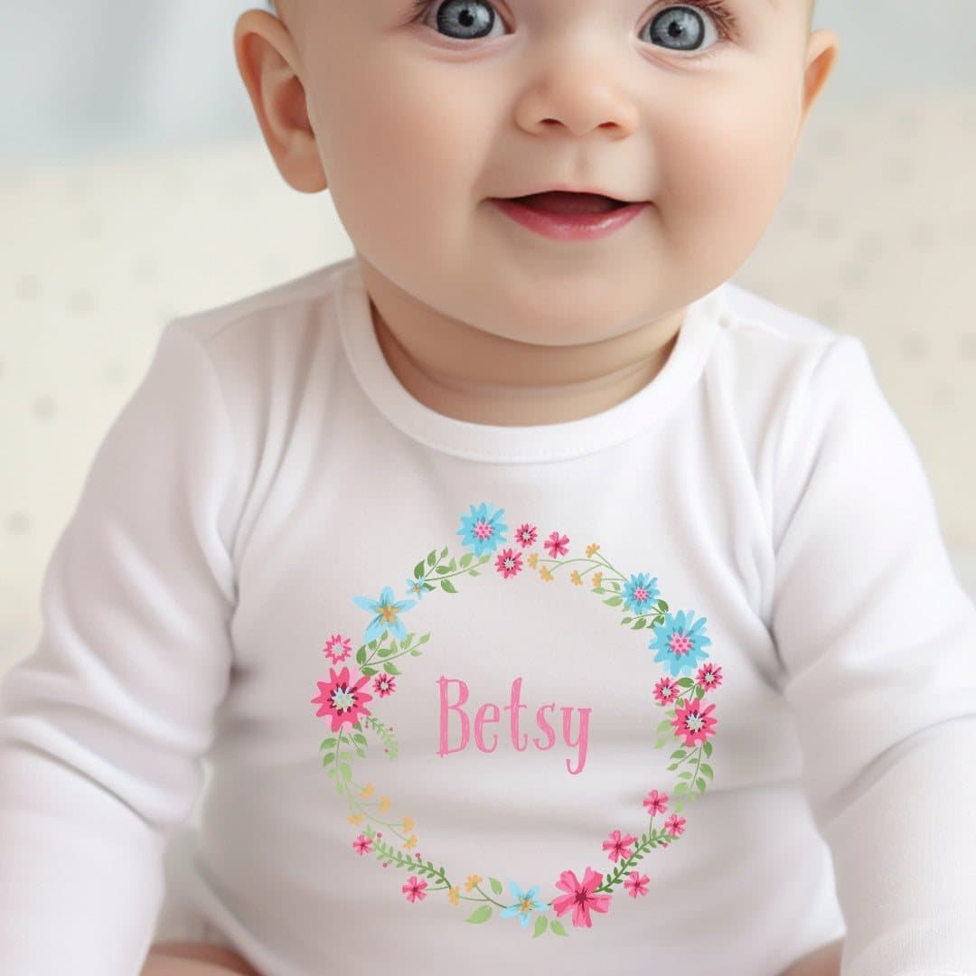 Personalised floral circle baby vest, baby grow or bib with a name