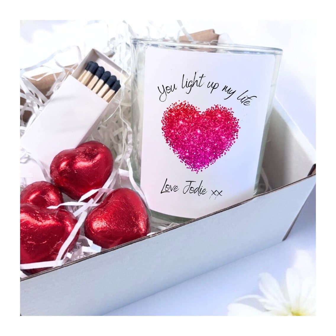 Sparkly pink heart candle gift set with a candle, chocolate hearts and matches.