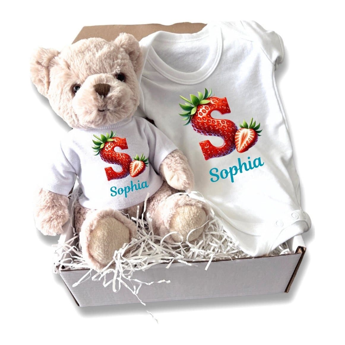Personalised strawberry baby gift box with a teddy bear and a baby vest in a white box
