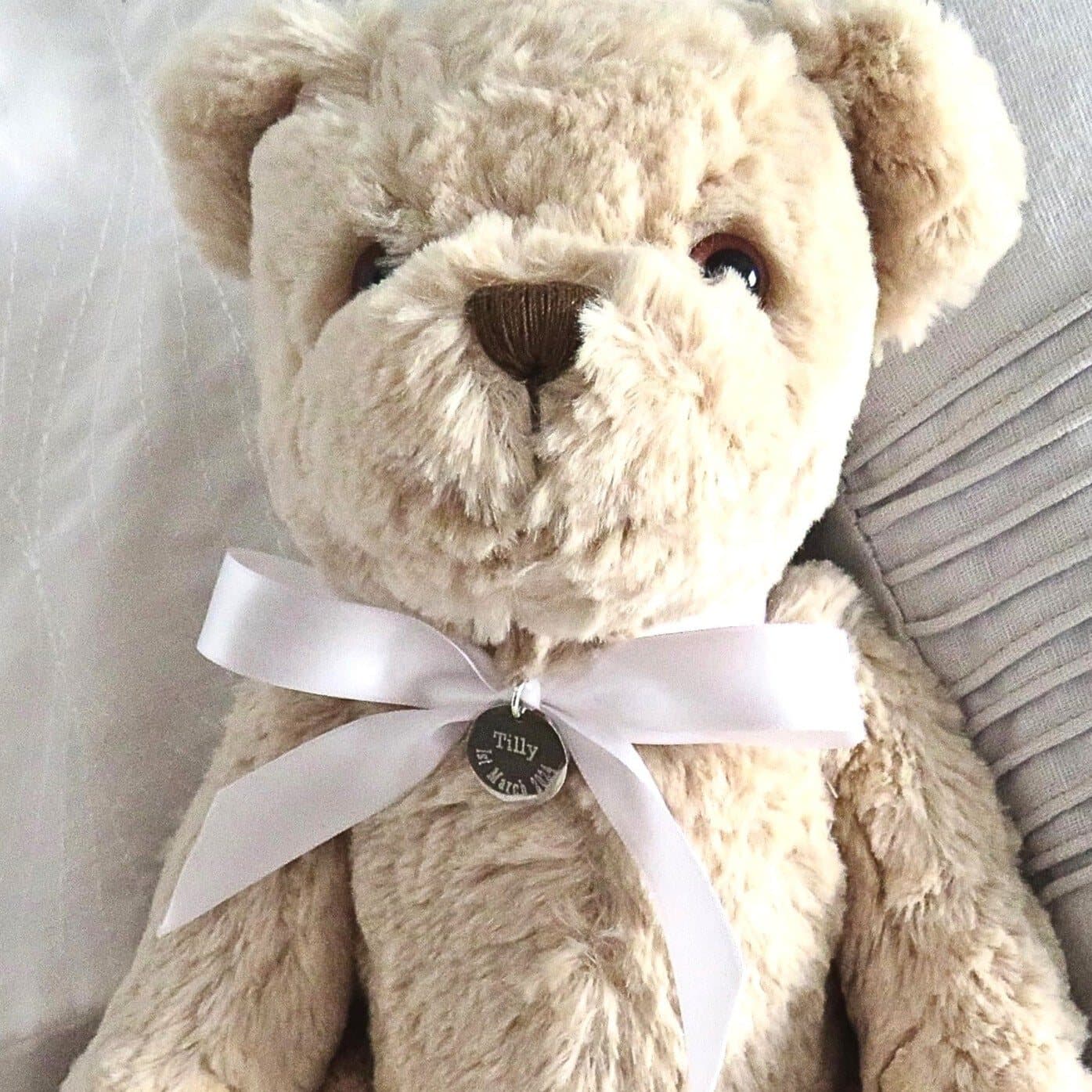 Personalised Luxury teddy bear with a stainless steel charm and ribbon