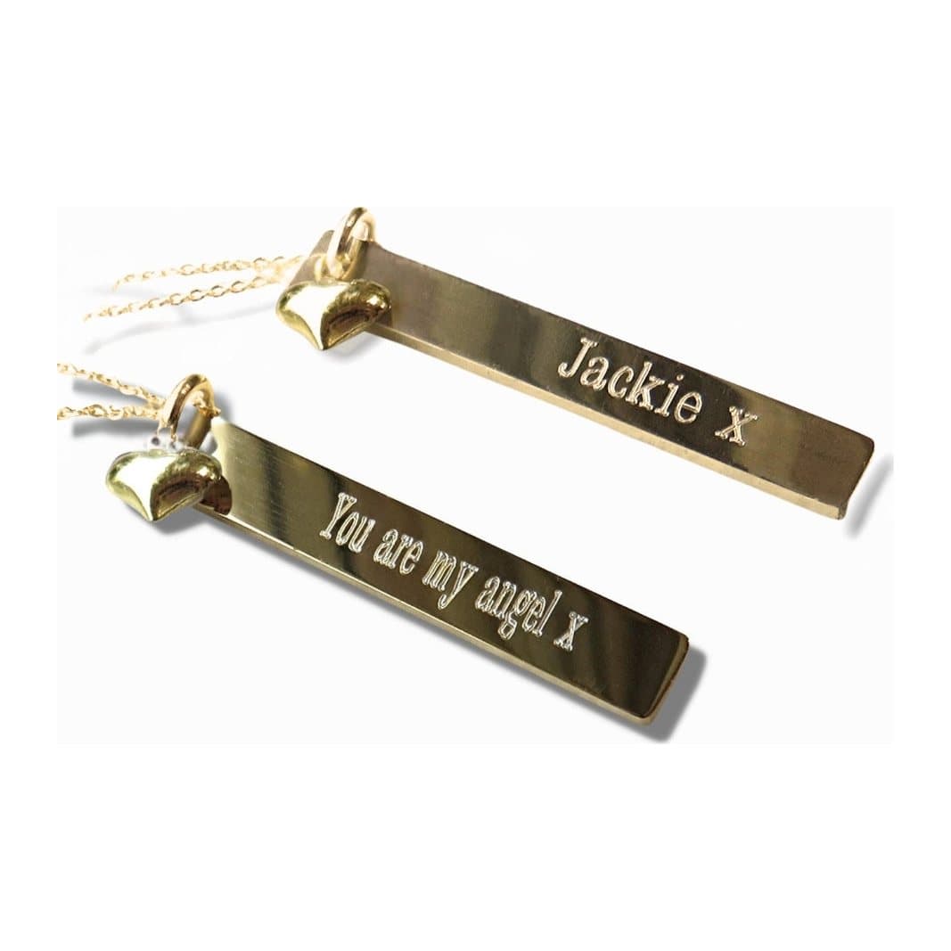 Personalised gold necklace with a thin engraved bar and a heart charm