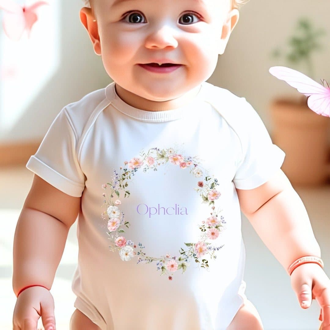 Personalised wild flower baby outfit with a name in the design