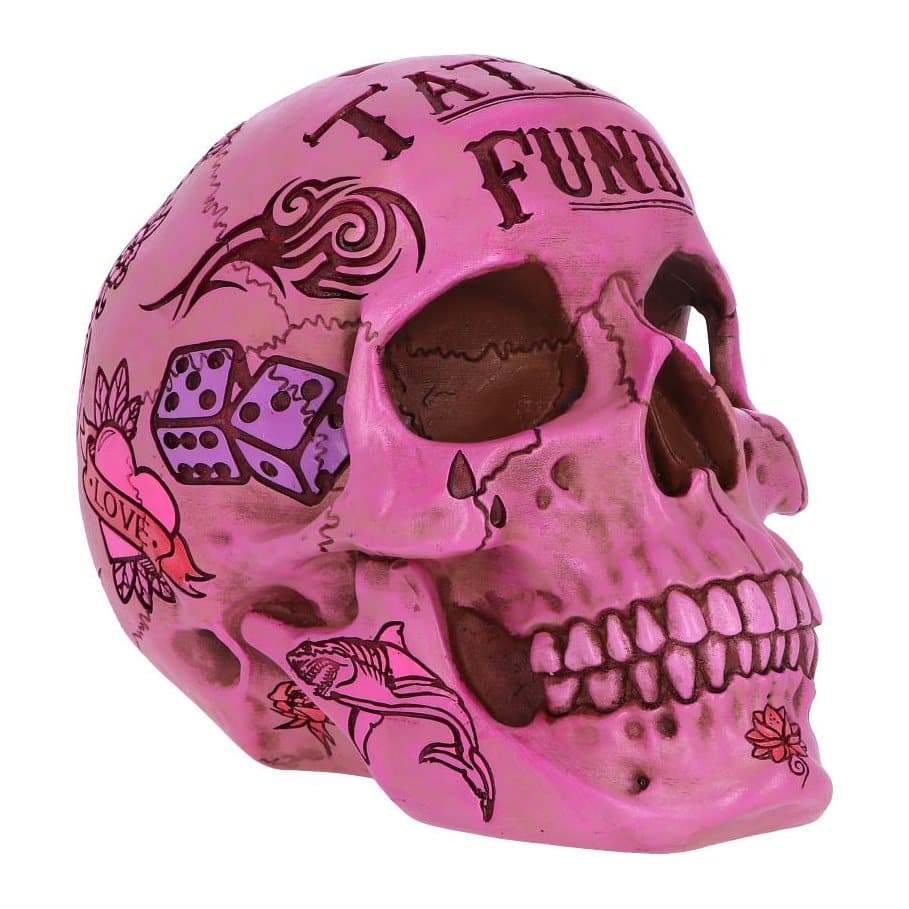 Pink skull money box painted with tattoo style designs