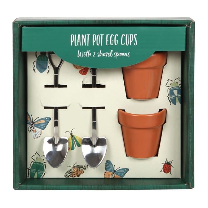 Two plant pot egg cups with little shovel spoons