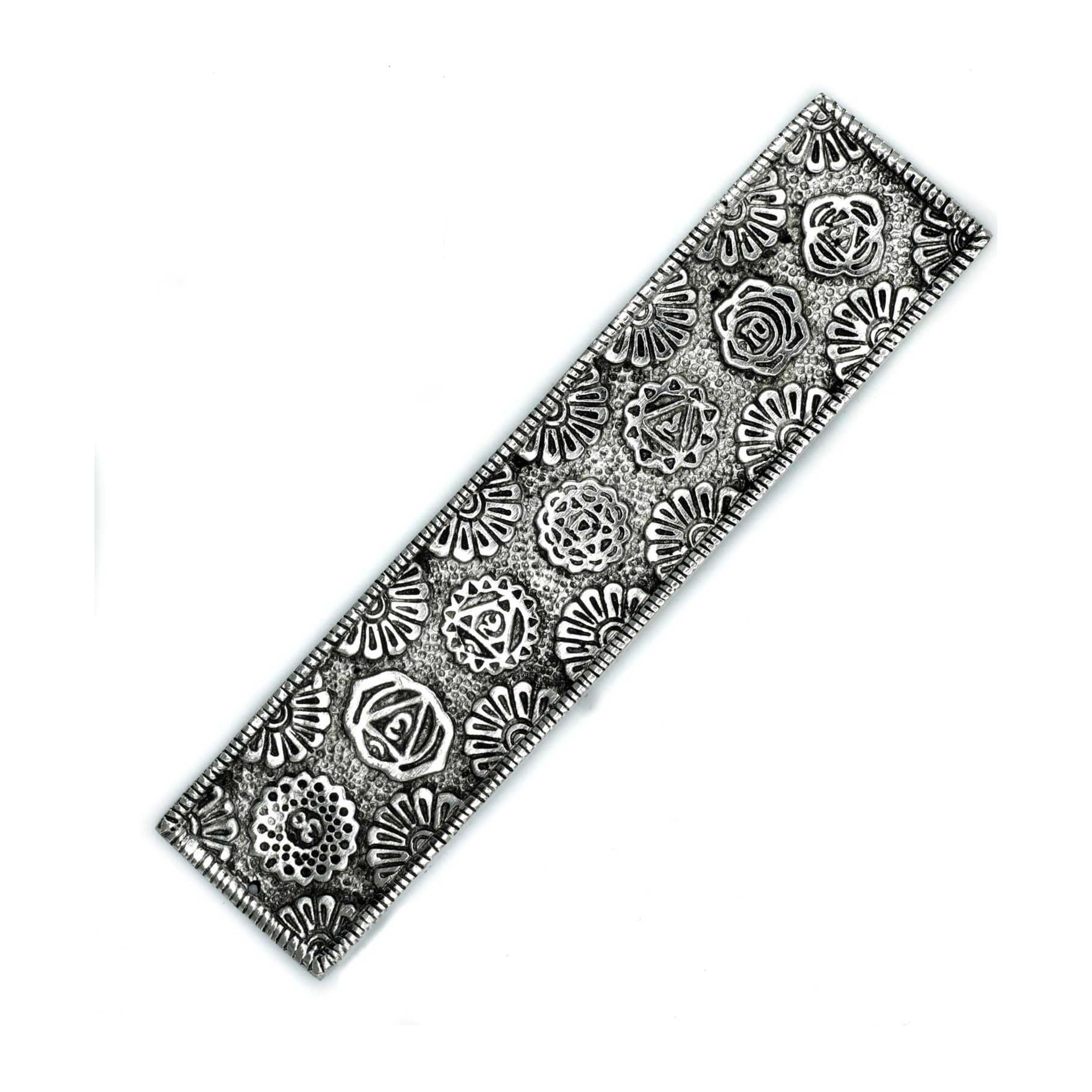 Long polished aluminium incense holder with a floral chakra design