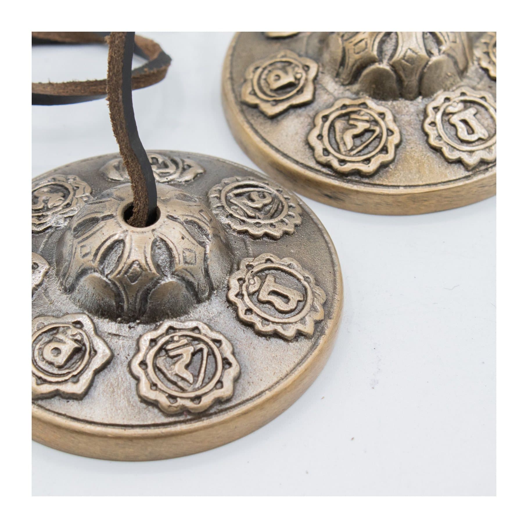 Brass Tibetan tingsha bells with seven chakra symbols