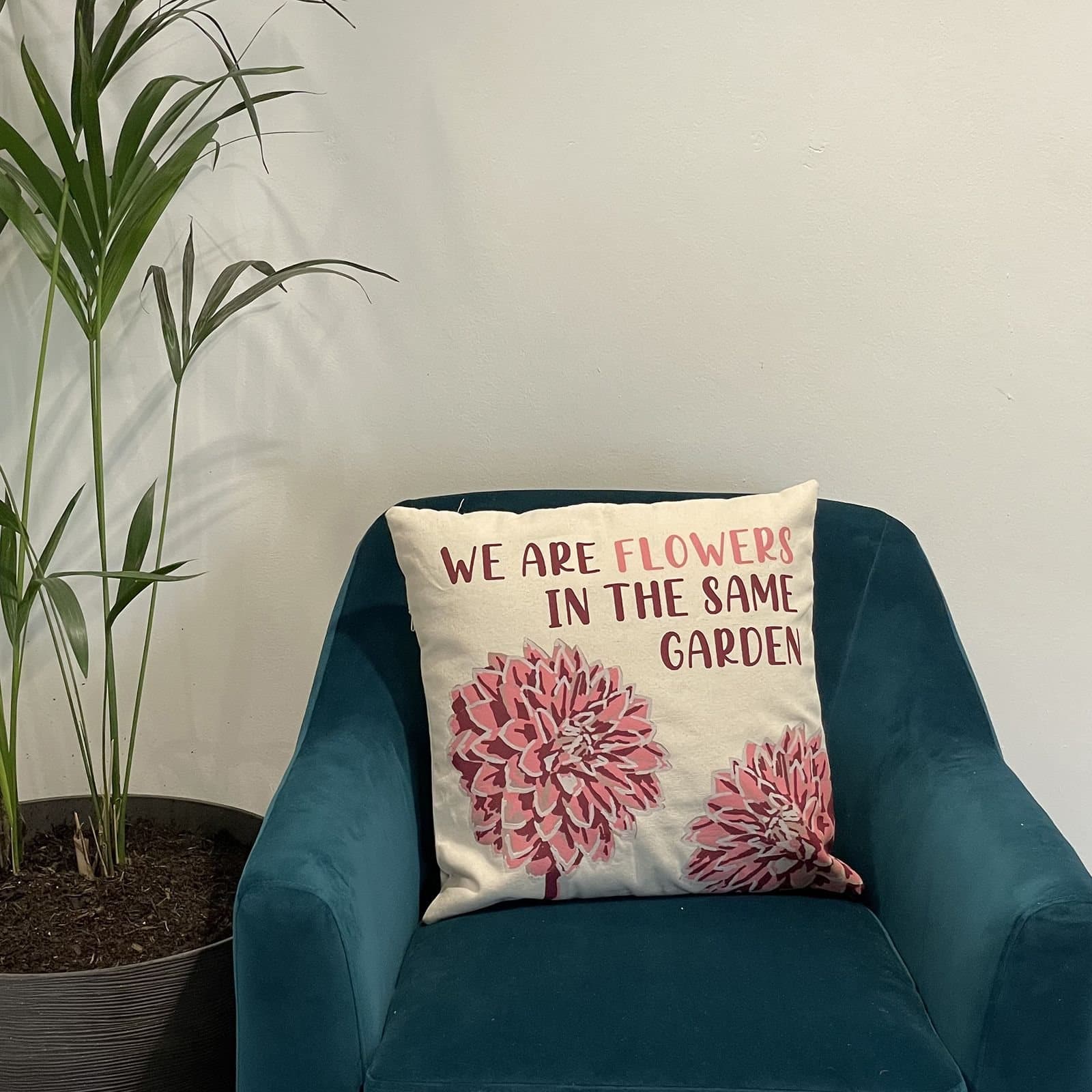 We Are Flowers printed cotton cushion cover in olive, pink and natural