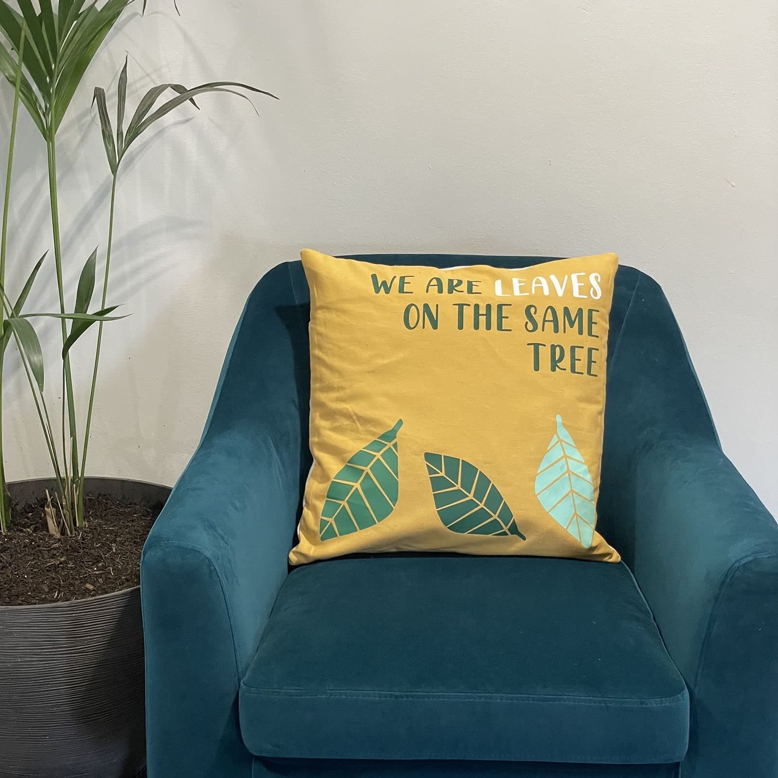 We Are Leaves printed cotton cushion cover in yellow, blue and natural