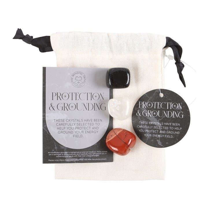 Crystal set of black obsidian, clear quartz and red jasper in a drawstring bag