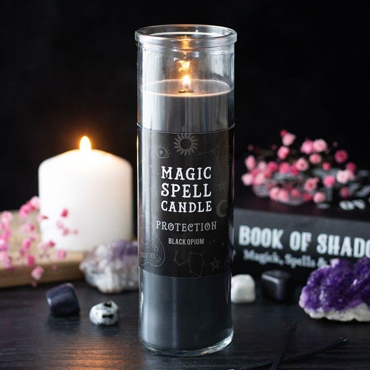 Tall opium-scented tube candle with a hang tag