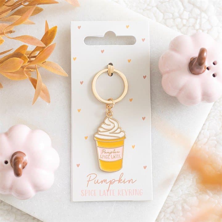 Pumpkin spice latte keyring with whipped cream detail on a cardboard back