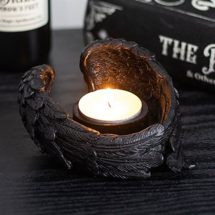 Tealight candle holder crafted in the shape of raven wings
