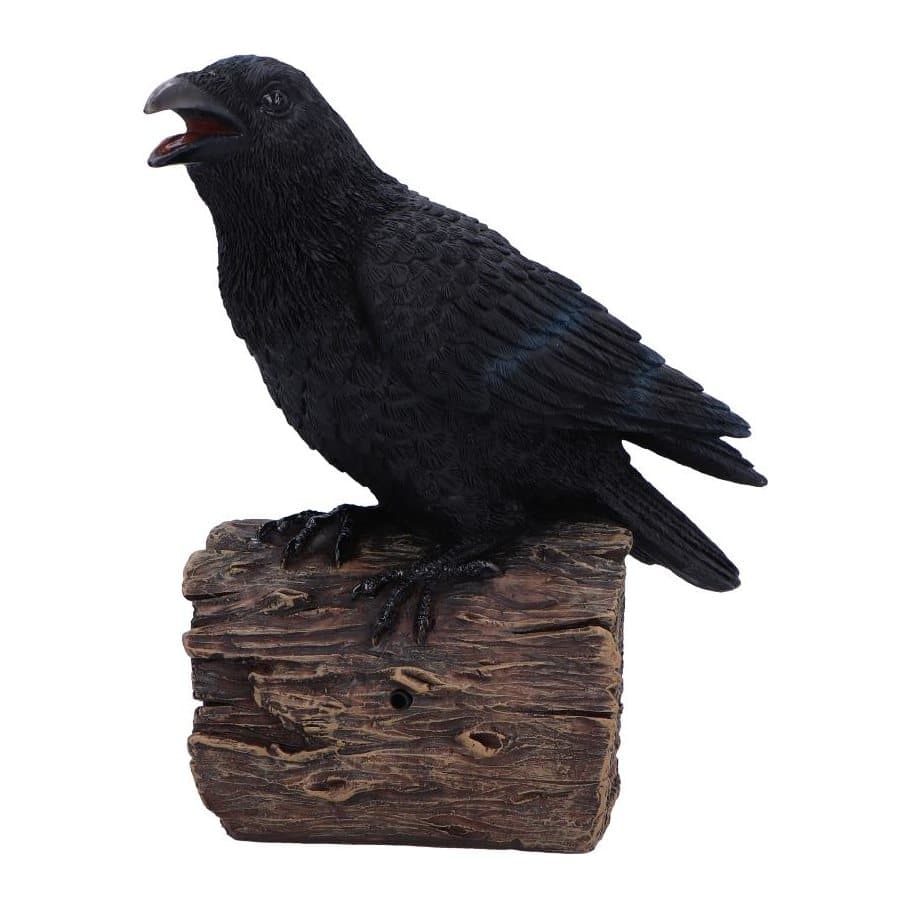 Black resin raven figurine with feather detailing on a faux wood base