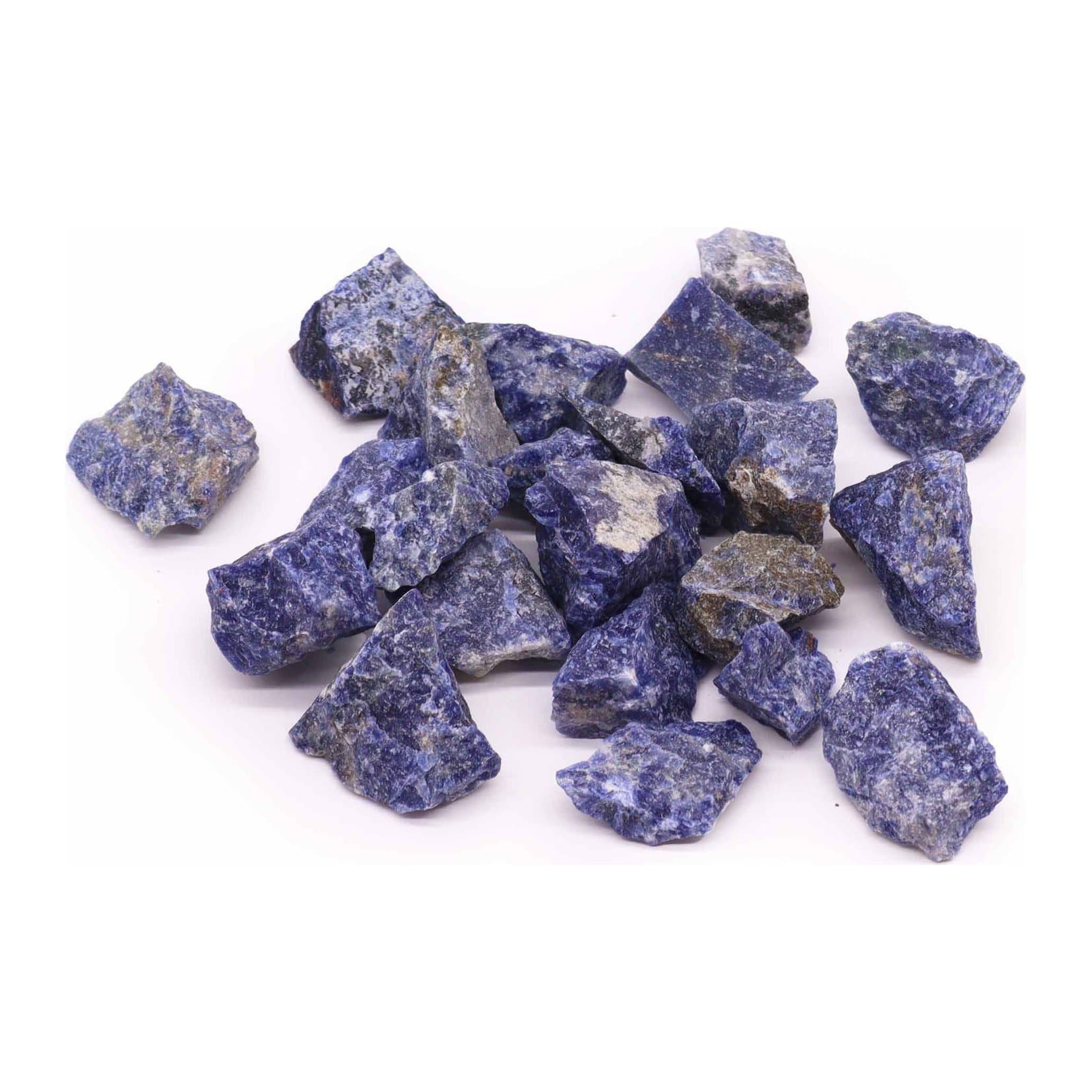 Pile of deep blue raw sodalite crystals with white veining