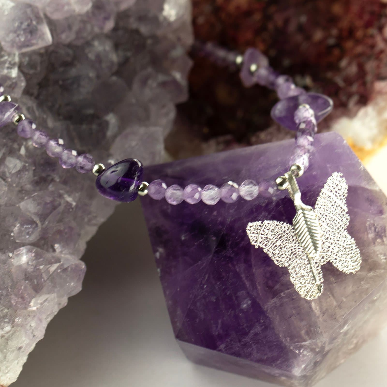 Gemstone necklace with a leaf butterfly pendant