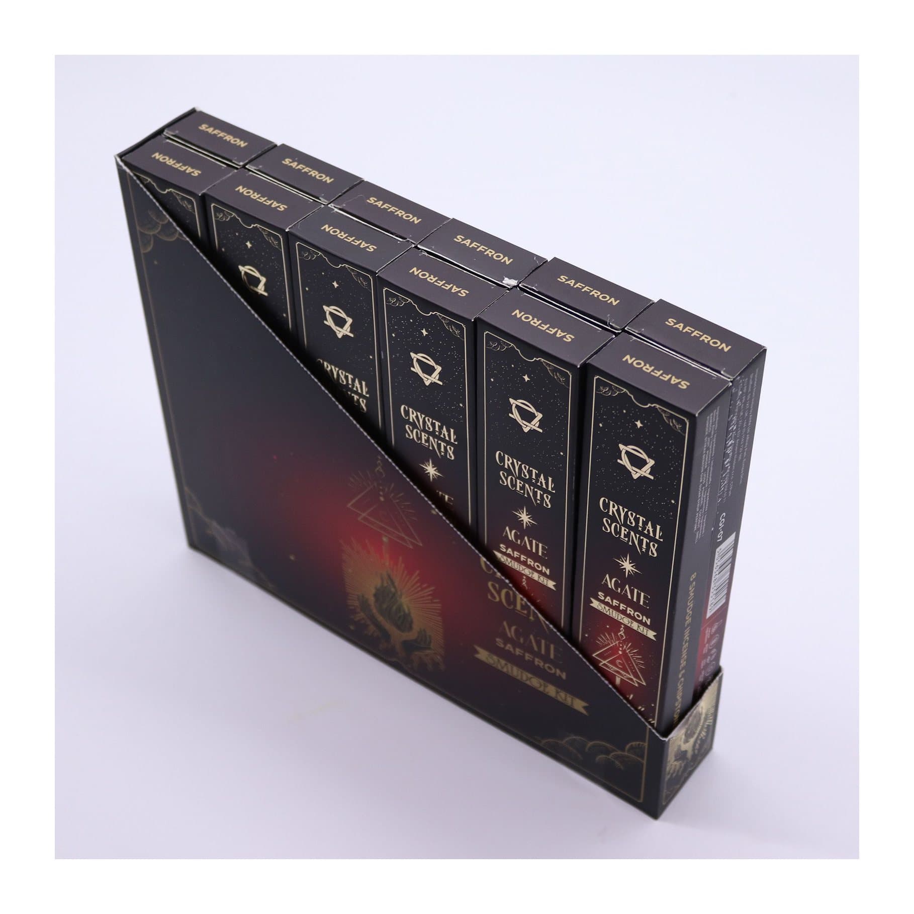 Saffron smudge incense sticks and red agate chips in a red cardboard sleeve