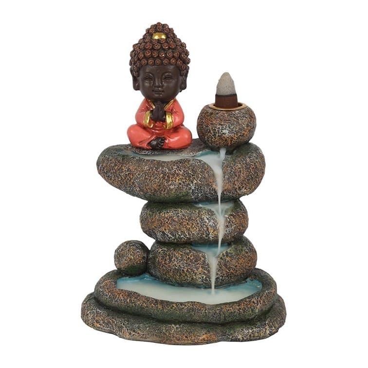 Red resin Buddha seated on a stacked rock pond backflow incense burner