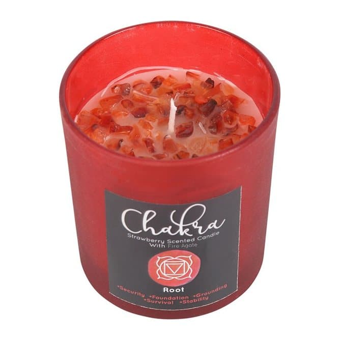 Red frosted glass candle with a metallic lid and fire agate crystal chips