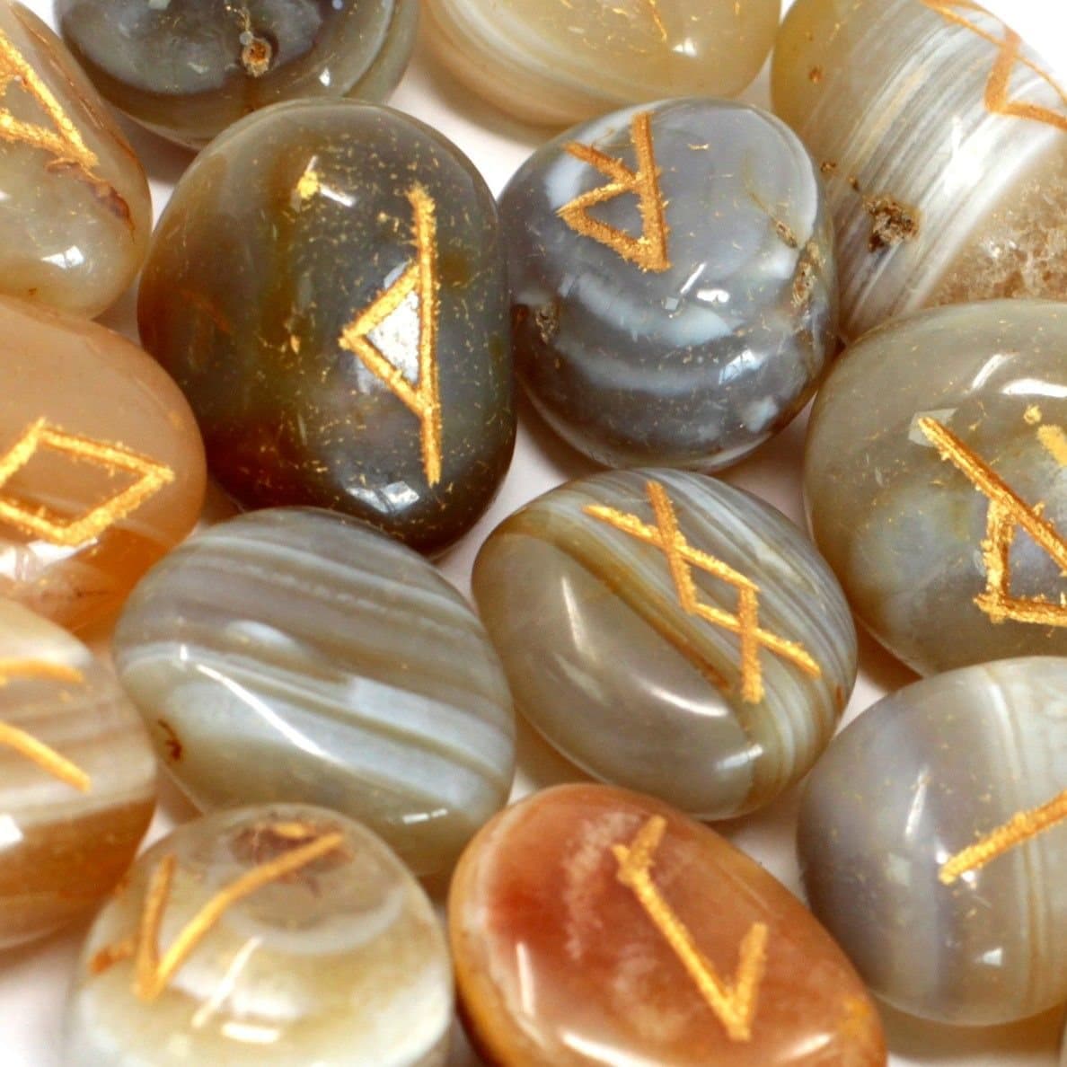 Banded agate rune stones in a printed pouch
