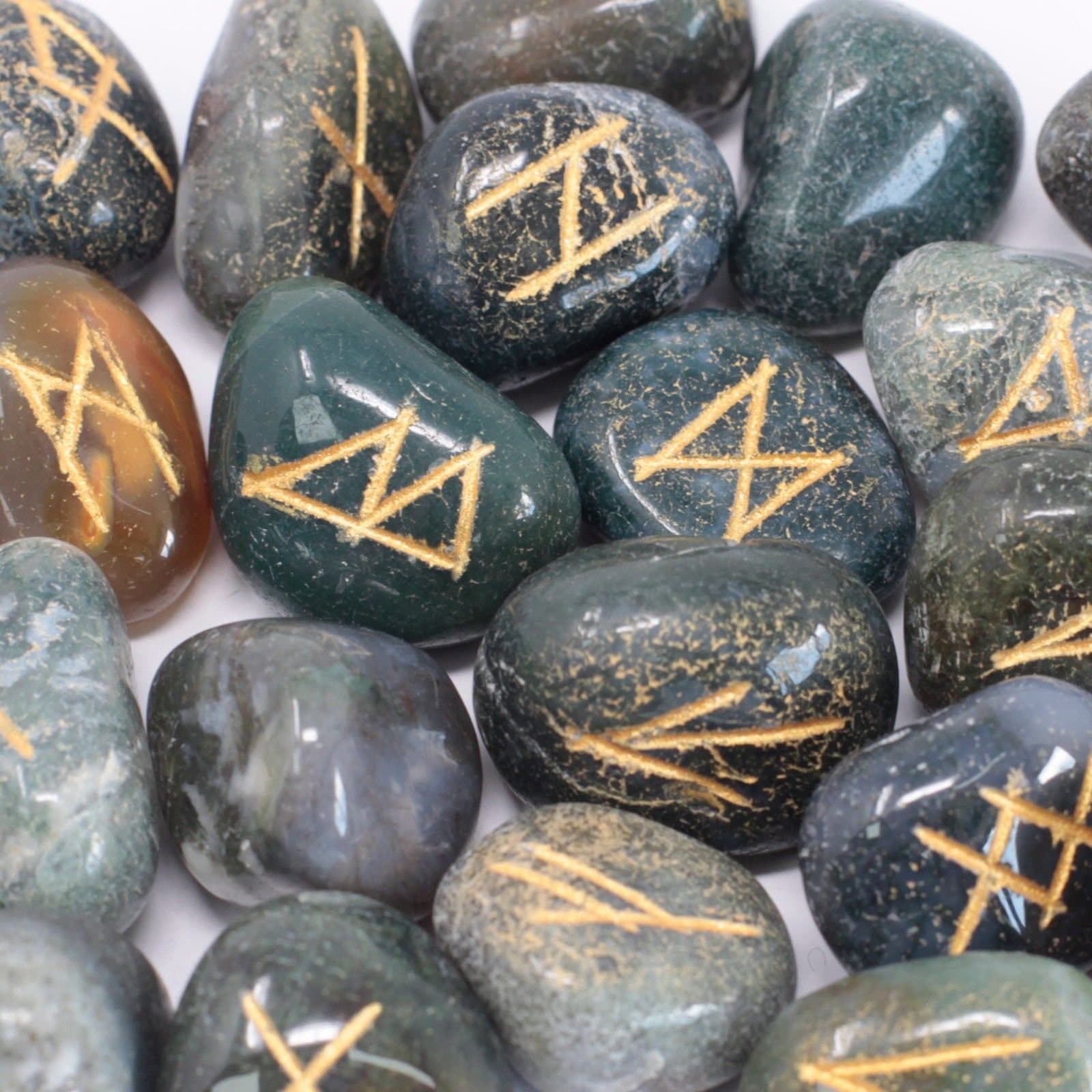 Moss agate rune stones set in a printed cotton pouch