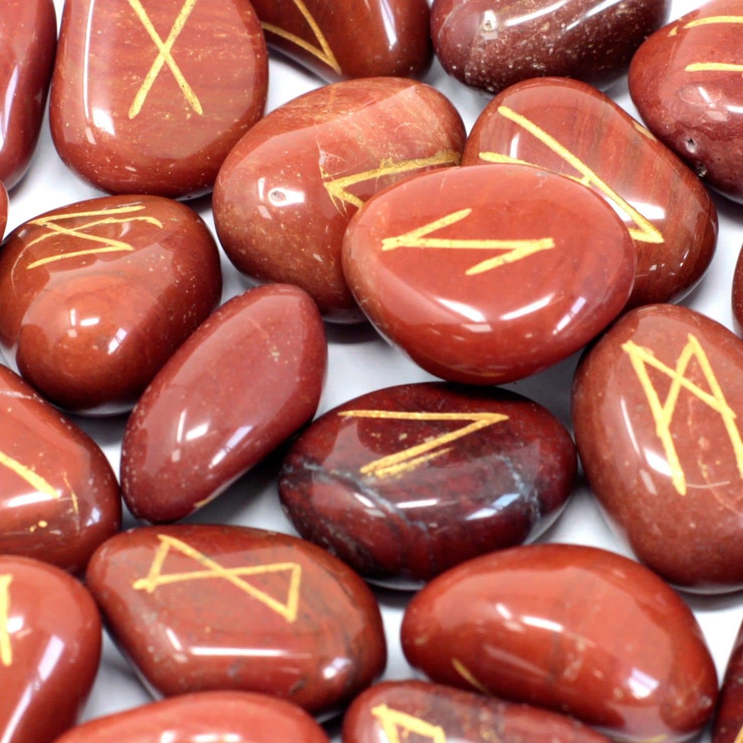Red jasper rune stones set in a printed cotton pouch