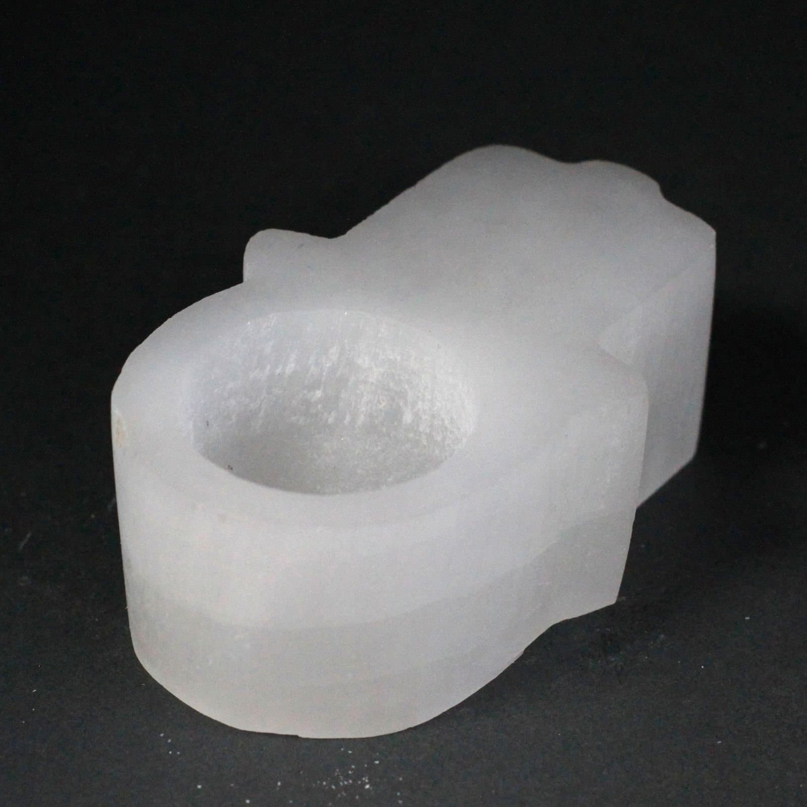 Translucent selenite hamsa candle holder
