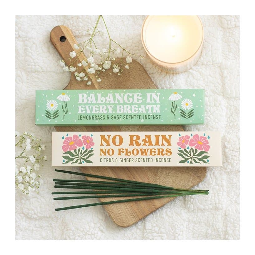 Two incense stick packs in a colour cardboard box with a window