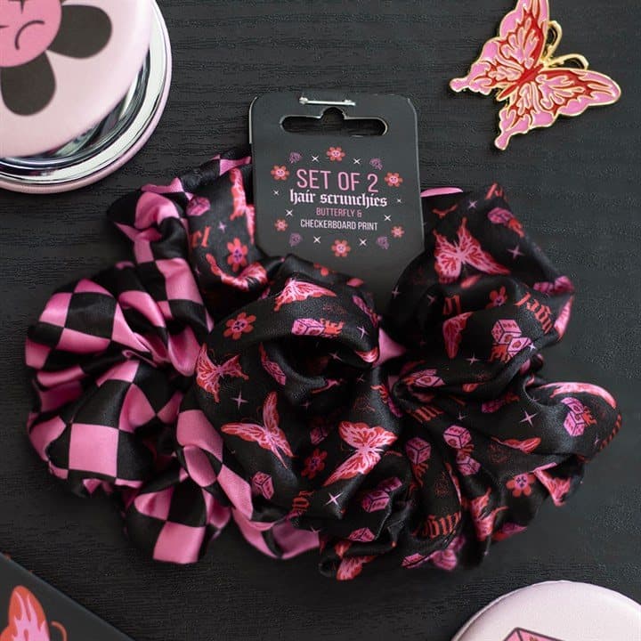 Two hair scrunchies, one cybersigil butterfly print and one pink checkerboard