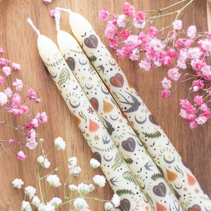 Set of 3 cream taper candles with a folk print in a window box