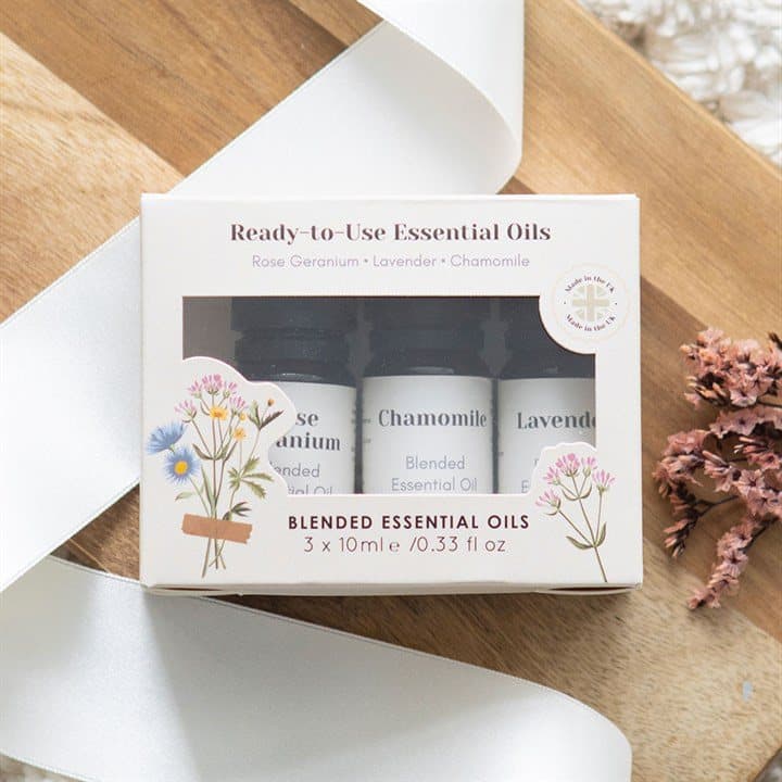 Set of three 10ml floral essential oil bottles in a colour cardboard box with window