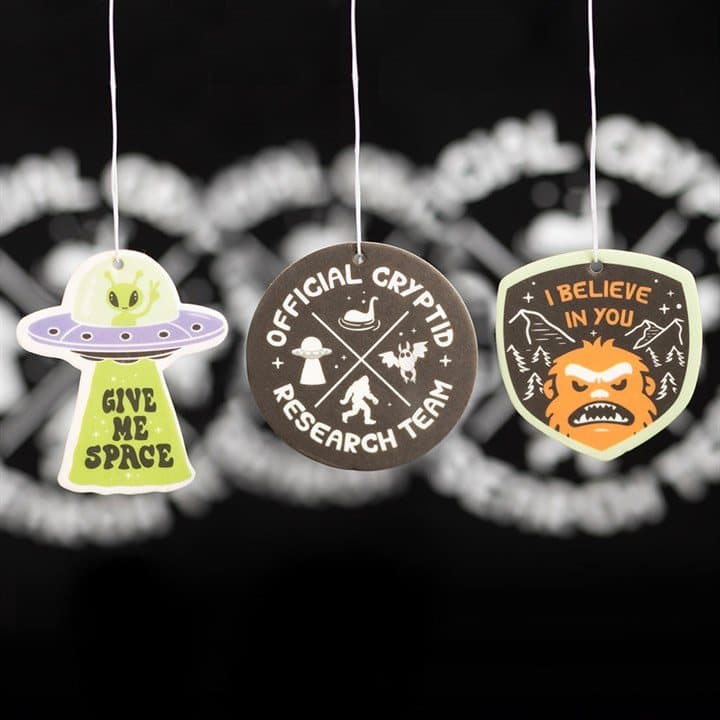 Pack of six cryptid themed air fresheners on a cardboard back