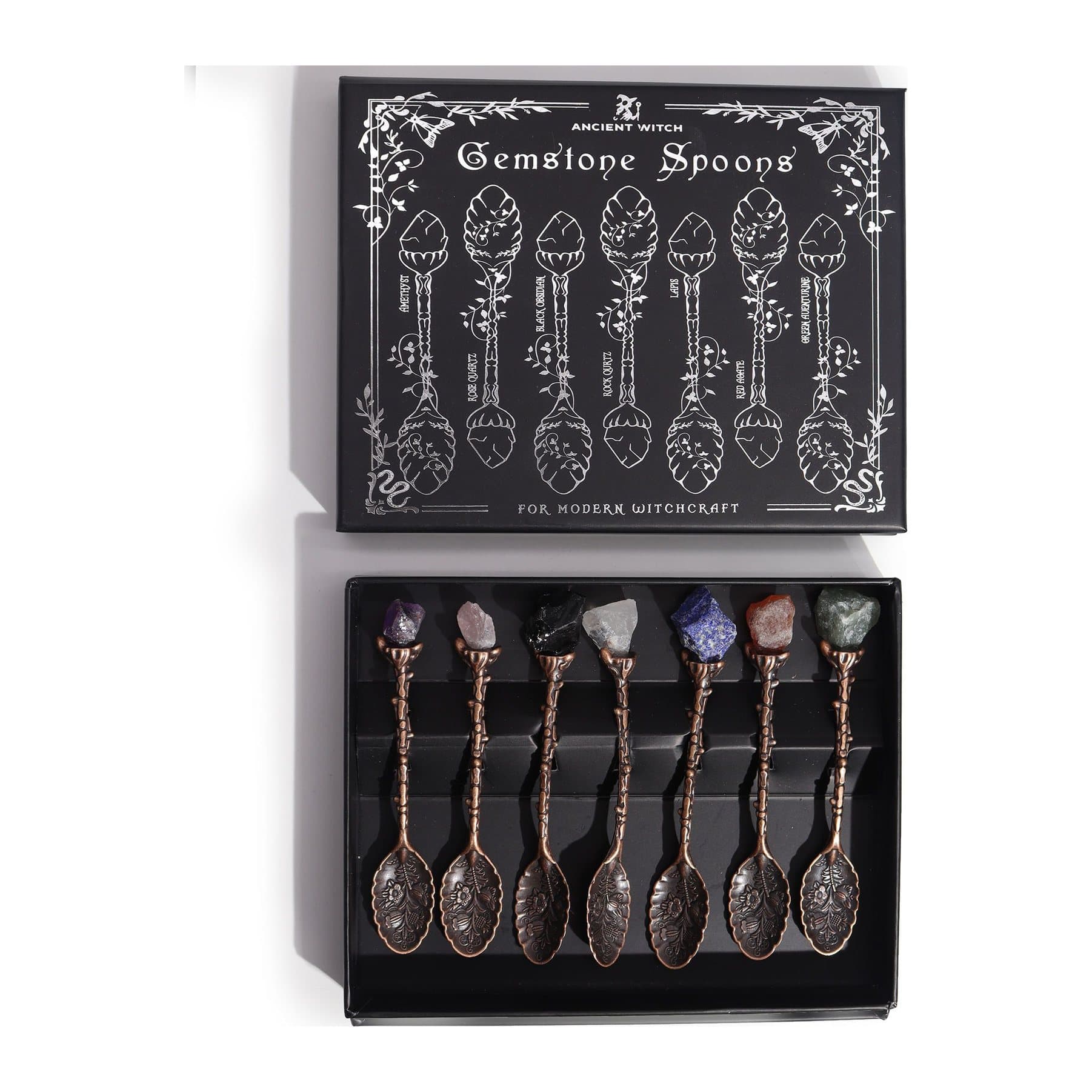 Set of 7 bronze witch spoons with gemstones