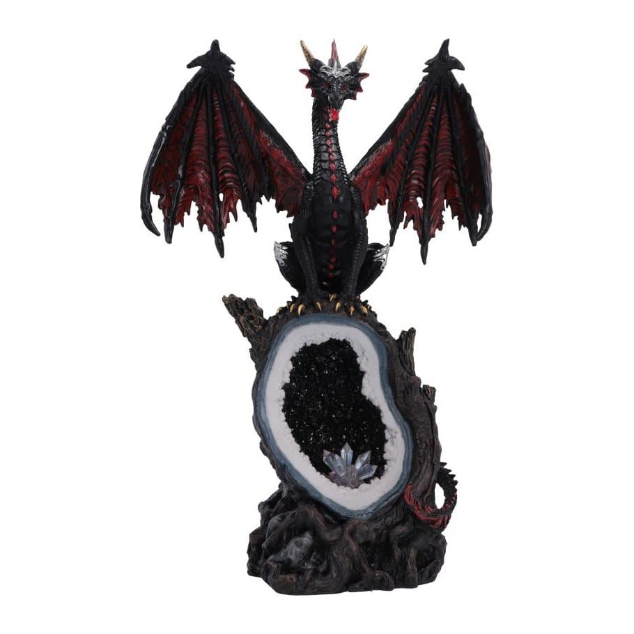 Black and red dragon figurine standing on an open crystal geode