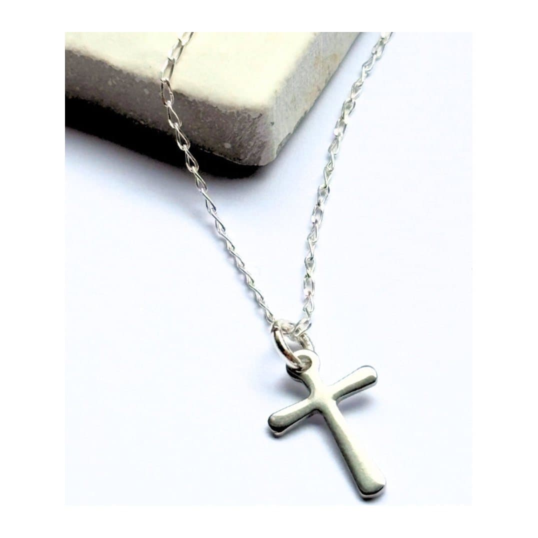 Silver cross charm necklace with a fine chain