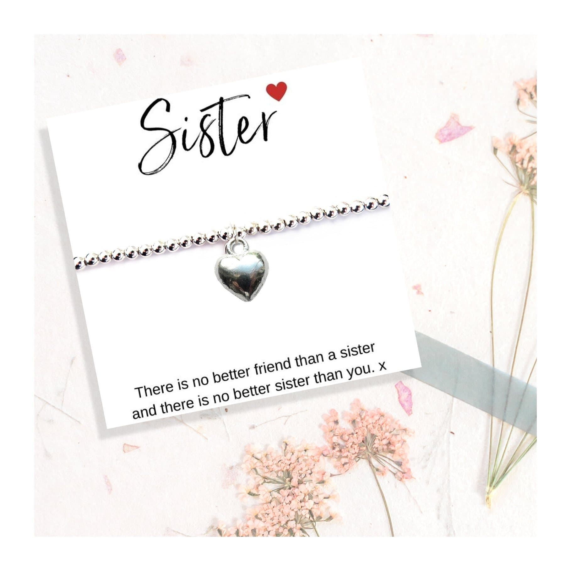 Silver heart charm on a stretch beaded bracelet, a gift for a sister