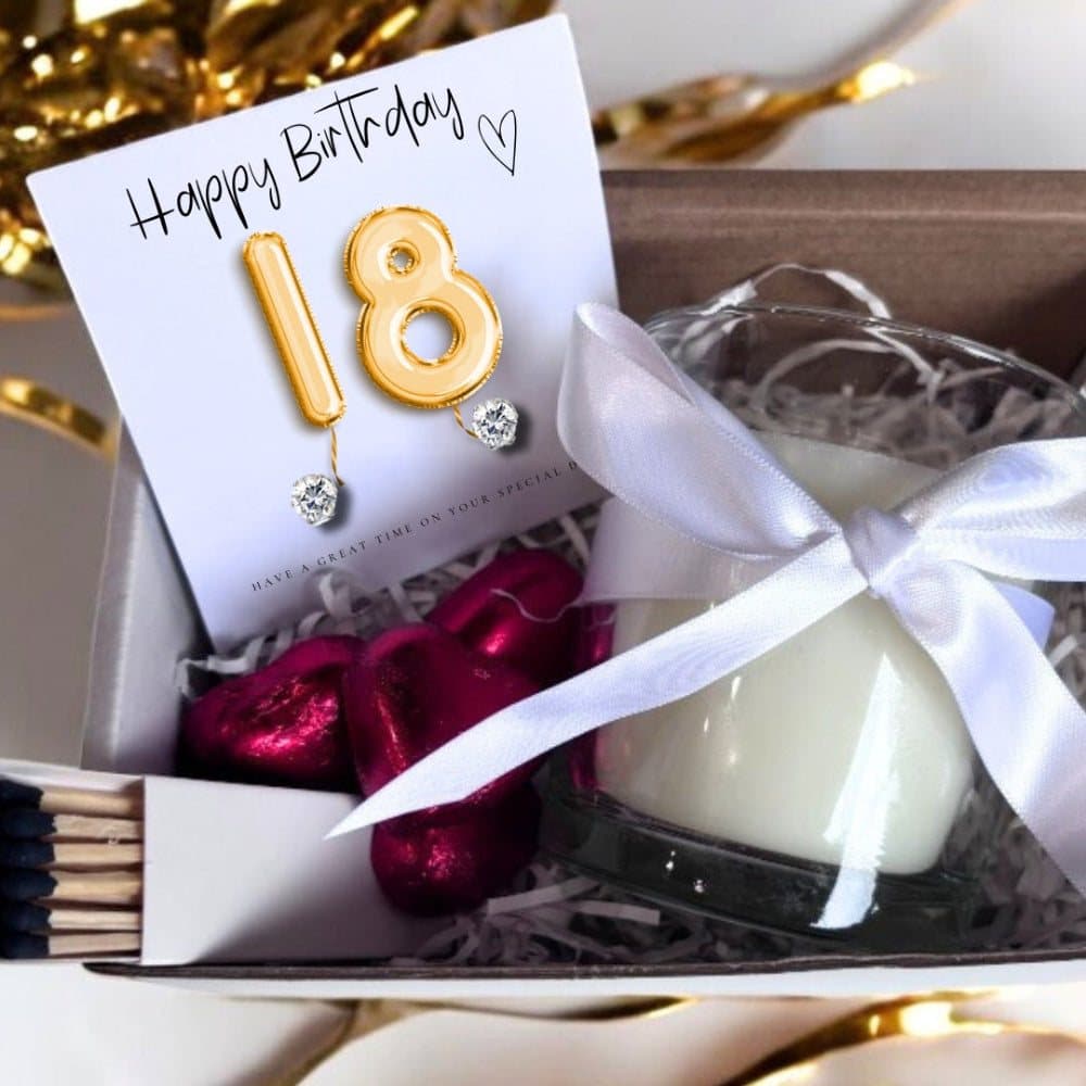 18th birthday gift hamper with gold balloons, earrings, candle and chocolate