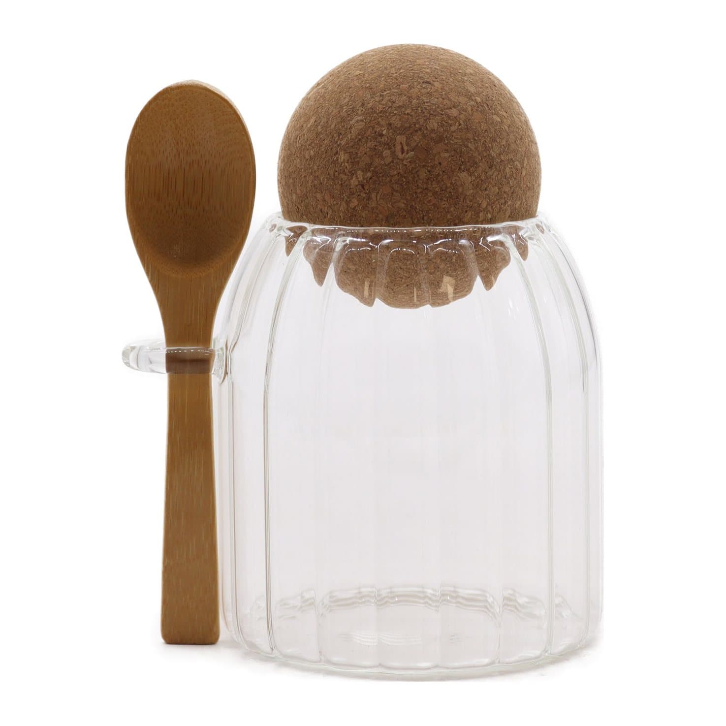 Small ribbed glass jar with a spoon