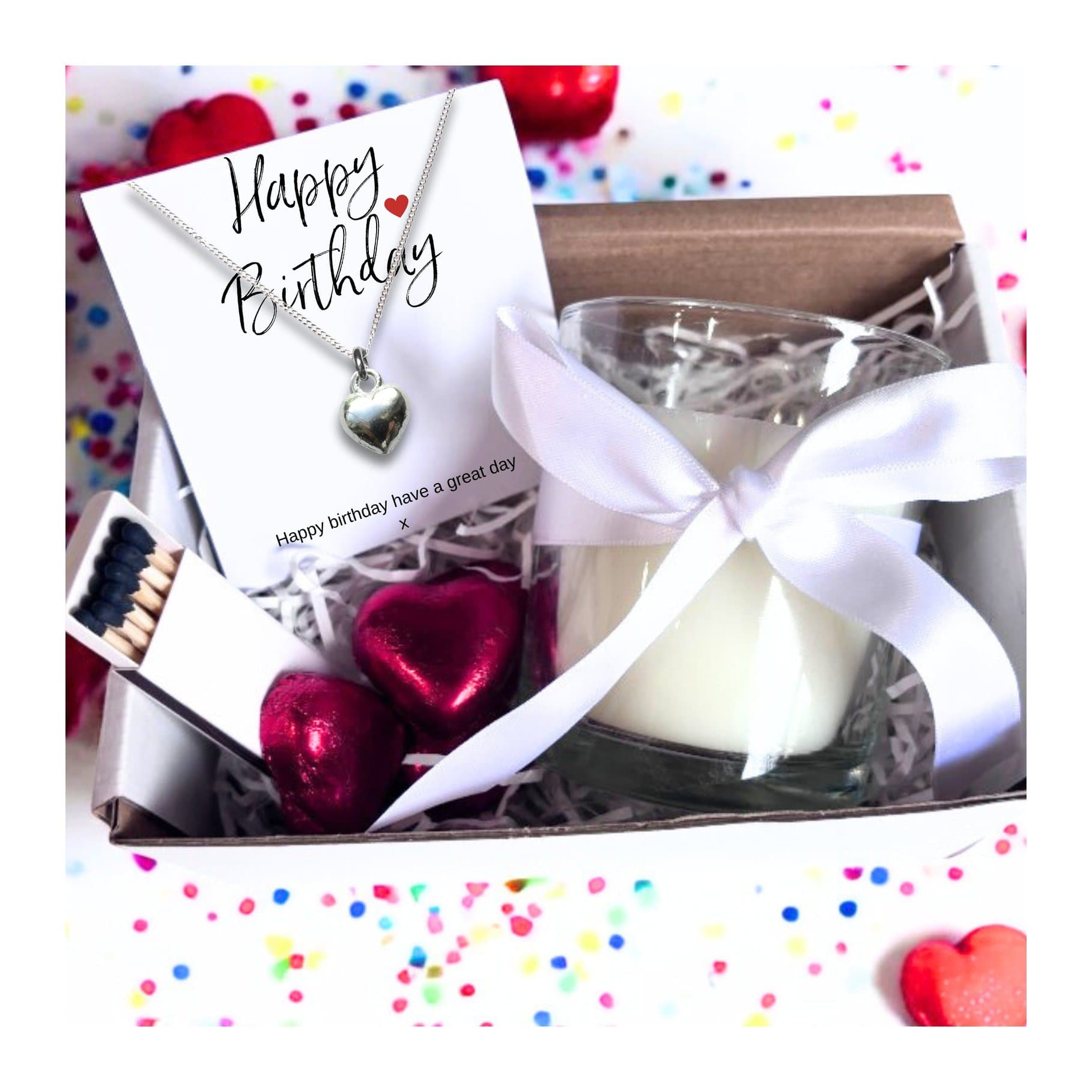 Birthday gift hamper with a silver heart necklace, a candle and milk chocolate hearts