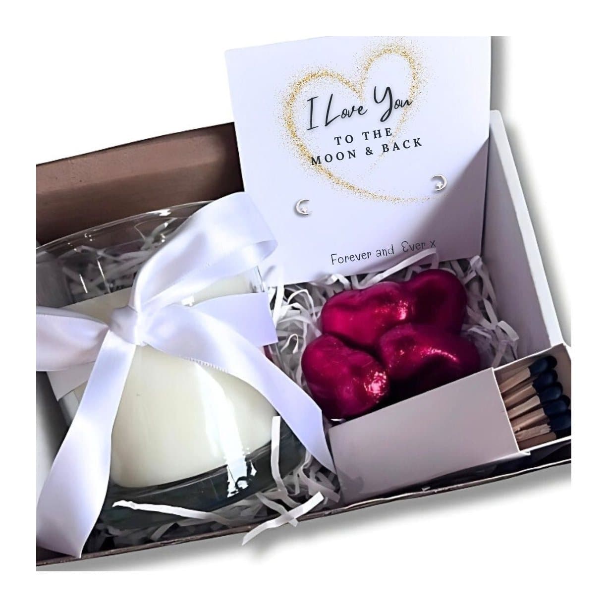 Gift hamper with silver stud earrings, a vanilla candle and red foiled chocolate hearts