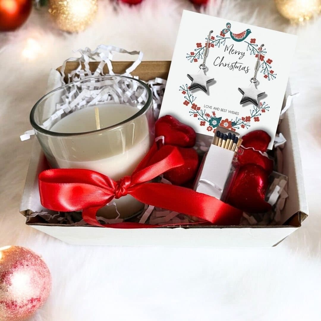 Christmas gift hamper with star drop earrings, vanilla candle and chocolate hearts