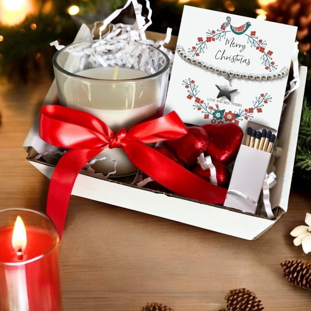 Silver star bracelet, vanilla candle and chocolate hearts in a Christmas hamper