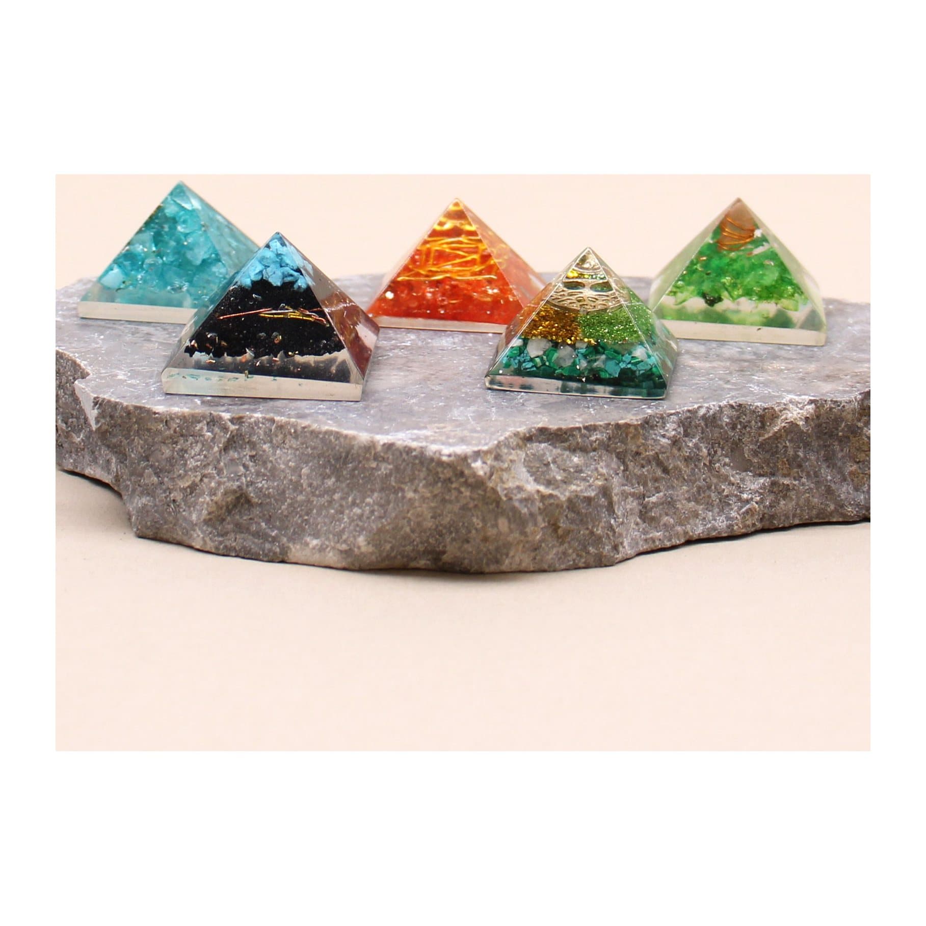Small orgonite pyramid with gemstone chips and copper in crystal resin