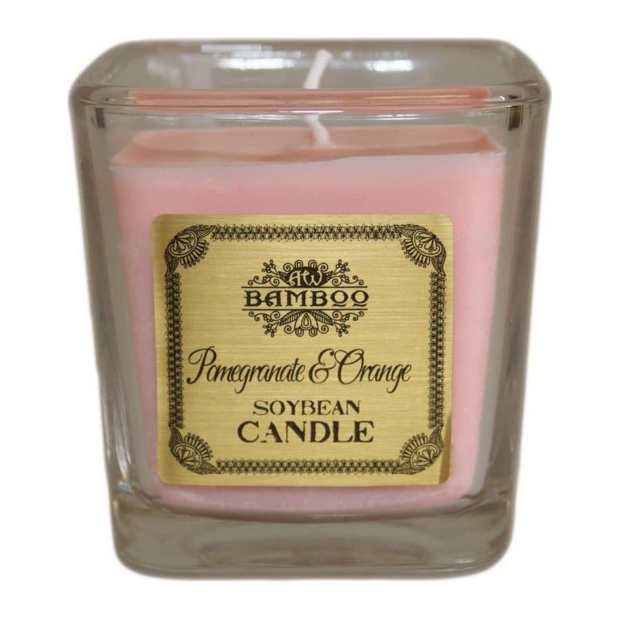 Pomegranate and orange soy wax candle in a recycled glass jar